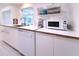Modern kitchen equipped with stainless steel appliances and ample counter space for meal preparation at 240 Pocono E Trl, Nokomis, FL 34275