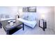 Bright living space featuring contemporary furnishings, chic decor, and light wood-look flooring at 240 Pocono E Trl, Nokomis, FL 34275