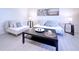 Modern living area showcasing a plush sofa, stylish decor, and contemporary furniture arrangement at 240 Pocono E Trl, Nokomis, FL 34275