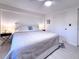 Comfortable bedroom featuring a king bed, side tables with lamps, and closet at 240 Pocono E Trl, Nokomis, FL 34275
