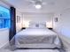 Cozy bedroom featuring a comfortable bed, stylish decor, and ample natural light at 240 Pocono E Trl, Nokomis, FL 34275