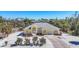 Inviting home featuring lush landscaping, a well-manicured lawn, and a charming entrance at 240 Spaniards Rd, Placida, FL 33946