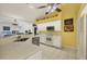 Updated kitchen featuring stainless steel appliances, white cabinets and light countertops at 240 Spaniards Rd, Placida, FL 33946
