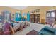 Airy living room featuring comfortable seating, elegant decor, and an abundance of natural light at 240 Spaniards Rd, Placida, FL 33946