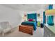 Bright main bedroom featuring a closet, a comfortable bed and a ceiling fan at 240 Spaniards Rd, Placida, FL 33946