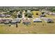 Wide aerial view of homes highlighting the neighborhood's layout, landscaping, and nearby amenities at 26506 Copiapo Cir, Punta Gorda, FL 33983