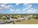 Aerial view of a community with pools and multiple single-Gathering homes at 26506 Copiapo Cir, Punta Gorda, FL 33983