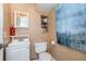 Cozy bathroom with white fixtures, shelving, and warm color palette at 26506 Copiapo Cir, Punta Gorda, FL 33983