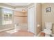 Bright bathroom with bathtub and shower combo, and a convenient toilet at 26506 Copiapo Cir, Punta Gorda, FL 33983