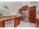 Well-lit kitchen features stainless appliances, granite counters, and lots of storage at 26506 Copiapo Cir, Punta Gorda, FL 33983