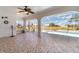 Large tiled lanai leading to a screened pool area at 26506 Copiapo Cir, Punta Gorda, FL 33983