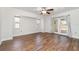 Large living room featuring wood floors and french doors to the outside patio at 26506 Copiapo Cir, Punta Gorda, FL 33983