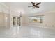 Spacious living room features tile floors, chandelier, and lots of light at 26506 Copiapo Cir, Punta Gorda, FL 33983