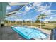 Inviting enclosed pool area with tile decking at 26506 Copiapo Cir, Punta Gorda, FL 33983