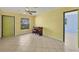 Bright, tile-floored living space features a ceiling fan, windows, and closet at 3006 42Nd W St, Bradenton, FL 34205