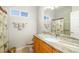 Bathroom featuring wood cabinets, granite countertops and natural light at 391 Snapdragon Loop, Bradenton, FL 34212