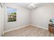 Empty bedroom with laminate floors and a window for plenty of natural light at 391 Snapdragon Loop, Bradenton, FL 34212