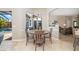 Cozy dining room with natural light, overlooking the pool area at 391 Snapdragon Loop, Bradenton, FL 34212