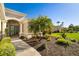 Charming entrance with a well-maintained walkway, beautiful landscaping, and a welcoming doorway at 391 Snapdragon Loop, Bradenton, FL 34212