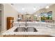 Open kitchen with granite countertops and stainless steel sink overlooking the pool at 391 Snapdragon Loop, Bradenton, FL 34212