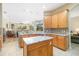 Spacious kitchen with granite countertops, stainless steel appliances, and an island, great for cooking at 391 Snapdragon Loop, Bradenton, FL 34212