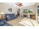 Bright living room with a stone fireplace and hardwood floors at 391 Snapdragon Loop, Bradenton, FL 34212