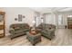 Comfortable living room with neutral decor, arched doorway, nice furnishings and lots of natural light throughout at 391 Snapdragon Loop, Bradenton, FL 34212