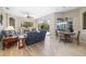 Open-concept living space with hardwood floors, fireplace and pool view at 391 Snapdragon Loop, Bradenton, FL 34212