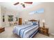 Cozy main bedroom with a large window and ceiling fan, offering relaxation at 391 Snapdragon Loop, Bradenton, FL 34212