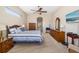 Comfortable main bedroom with ample space, ceiling fan, and neutral decor at 391 Snapdragon Loop, Bradenton, FL 34212