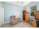 A home office features a comfortable chair, natural light and laminate flooring at 391 Snapdragon Loop, Bradenton, FL 34212