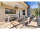 Inviting covered patio with lounge chairs and a bar perfect for outdoor relaxation at 391 Snapdragon Loop, Bradenton, FL 34212