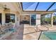 Covered patio with outdoor dining and living spaces, view to the living room at 391 Snapdragon Loop, Bradenton, FL 34212