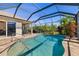 Beautiful pool with a screen enclosure and serene backyard views at 391 Snapdragon Loop, Bradenton, FL 34212