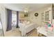 Cozy bedroom featuring a white iron bed, a ceiling fan, and a decorative wreath at 4108 Kingsfield Dr, Parrish, FL 34219