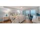 Comfortable bedroom with a balcony overlooking the ocean at 420 Beach Rd # 502, Sarasota, FL 34242