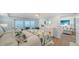 Comfortable bedroom featuring a balcony overlooking the beach and the ocean at 420 Beach Rd # 502, Sarasota, FL 34242