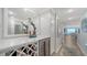 Tastefully decorated hallway with wine storage, bar area, and a view of the ocean at 420 Beach Rd # 502, Sarasota, FL 34242