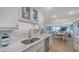 Bright, modern kitchen with stainless steel appliances, granite countertops, and an open floorplan at 420 Beach Rd # 502, Sarasota, FL 34242