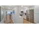 Modern kitchen with stainless steel appliances, white cabinetry, and hardwood floors at 420 Beach Rd # 502, Sarasota, FL 34242