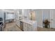 Bright and efficient kitchen with stainless appliances, marble countertops and an adjacent work space by the window at 420 Beach Rd # 502, Sarasota, FL 34242
