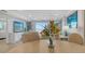 Open-concept dining and living area with a view of the ocean at 420 Beach Rd # 502, Sarasota, FL 34242