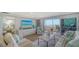 Spacious living room with a sliding glass door to the balcony overlooking the beach at 420 Beach Rd # 502, Sarasota, FL 34242