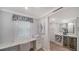 Bright workstation with marble countertop and a wine bar with a small refrigerator in an open concept living space at 420 Beach Rd # 502, Sarasota, FL 34242