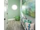 Hallway decorated in a coastal theme with unique decor and light green paint at 421 Spring Ave, Anna Maria, FL 34216