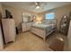 Comfortable bedroom with tile floors, a ceiling fan, and serene decor at 452 N Jefferson Ave # 117, Sarasota, FL 34237