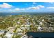 Stunning aerial view of a waterfront community featuring luxurious homes, beautiful lakes, and lush landscaping at 4646 Gleason Ave, Sarasota, FL 34242