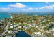 Overhead view showcases a beautiful coastal community with waterfront properties, serene lakes, and lush greenery at 4646 Gleason Ave, Sarasota, FL 34242