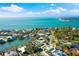 Aerial view of the home near a coastal neighborhood, beautiful beaches, and a pond at 4646 Gleason Ave, Sarasota, FL 34242