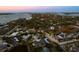 Wide aerial perspective showing a coastal community nestled along a waterfront and nearby islands at 4646 Gleason Ave, Sarasota, FL 34242